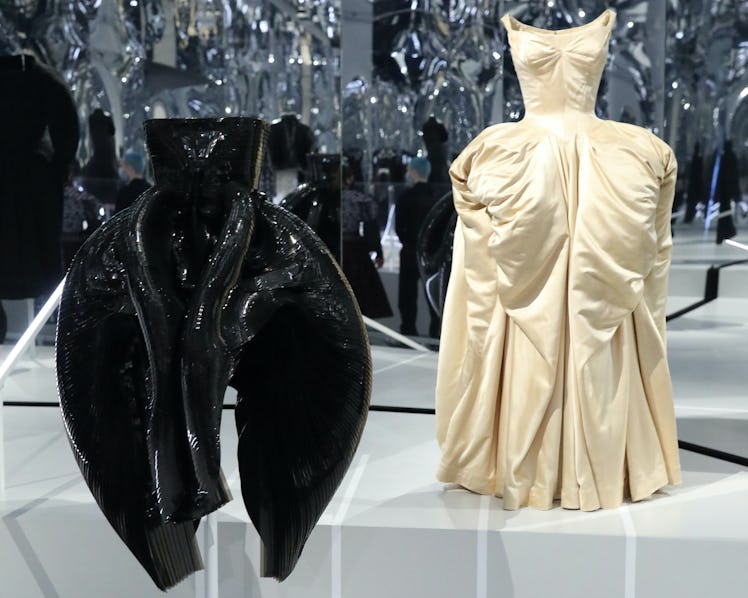 Two Iris van Herpen and Charles James black and yellow dresses