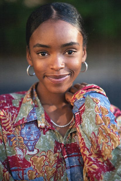 Lovie Simone in an oversized, multicolored button-up 