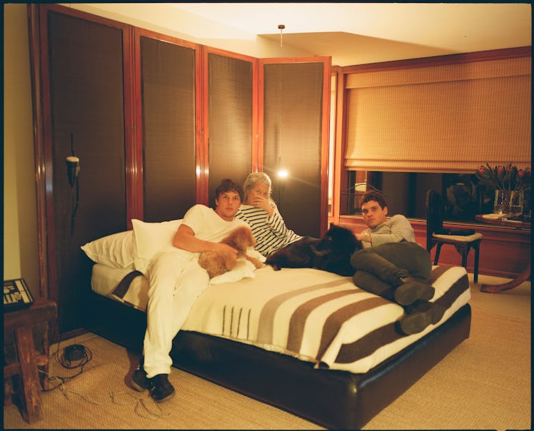 “In my mom’s room with Gus and the dogs.” Photograph by Theo Wenner