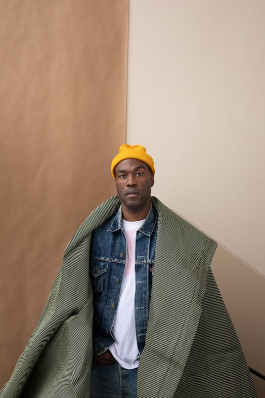 Yahya Abdul-Mateen II wearing Levi’s jacket and jeans and a yellow beanie for 'W' cover