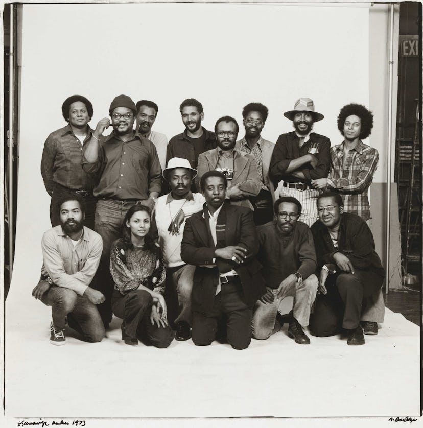 Anthony Barboza and other Kamoinge members posing on a black and white photo
