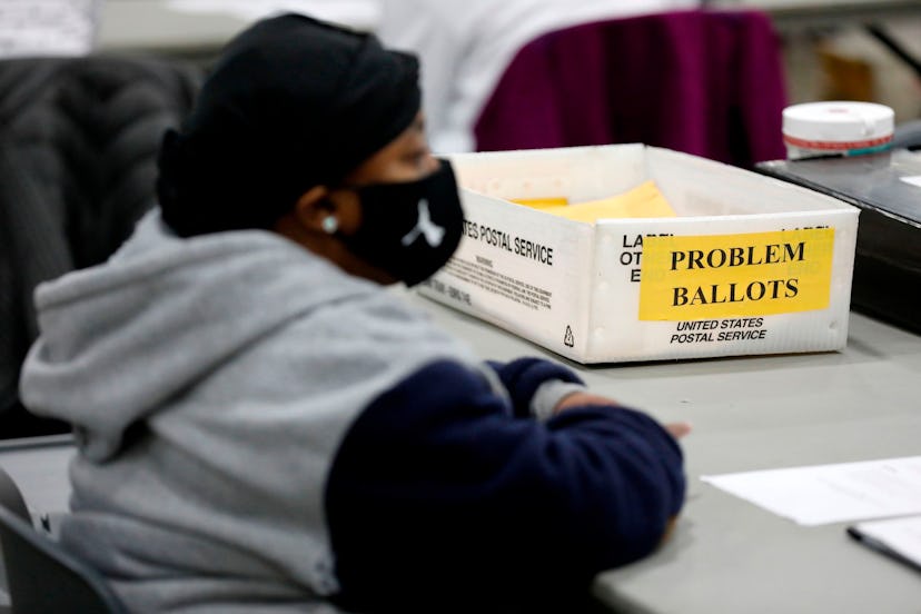 An election poll worker with "problem ballots"