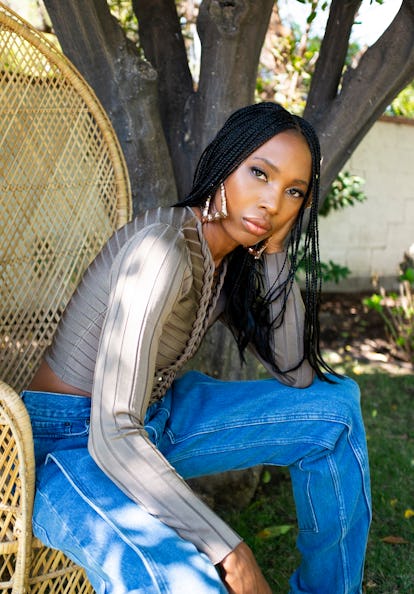 Zerina Akers, the founder of the Black Owned Everything online marketplace posing in a garden