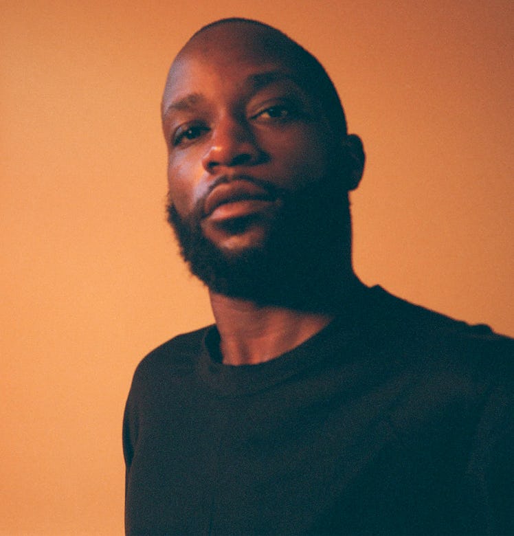 John Edmonds wearing a black shirt while posing for a photo