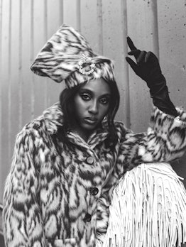 Ziwe Fumudoh wearing a Marc Jacobs coat with an animal print and a matching hat