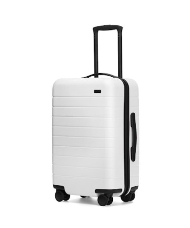 A white Away suitcase