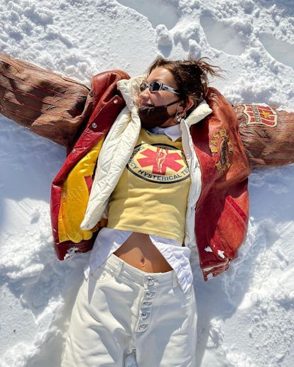 bella hadid making snow angels