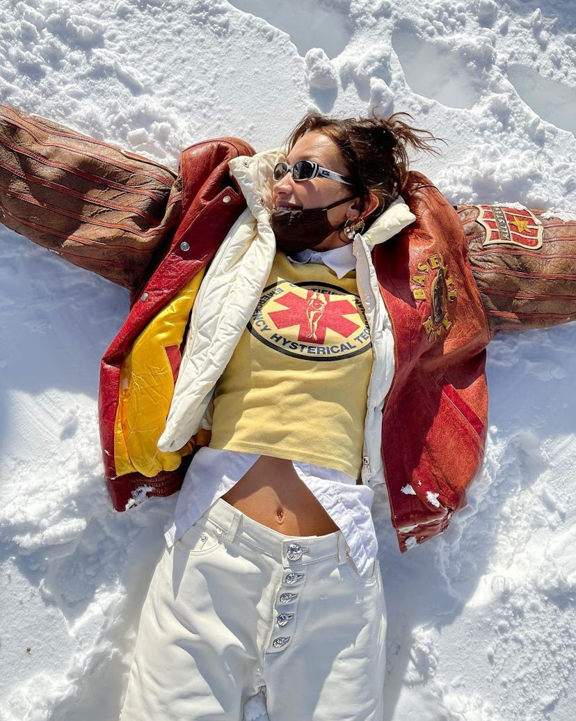 bella hadid making snow angels