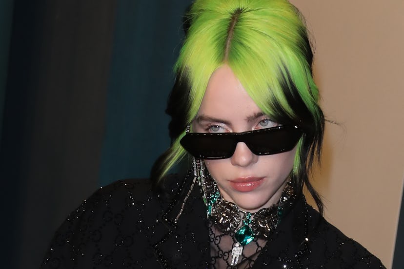Billie Eilish with green hair.