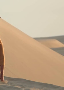 A YSL model in a sand dune