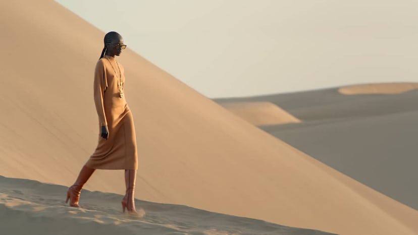 A YSL model in a sand dune