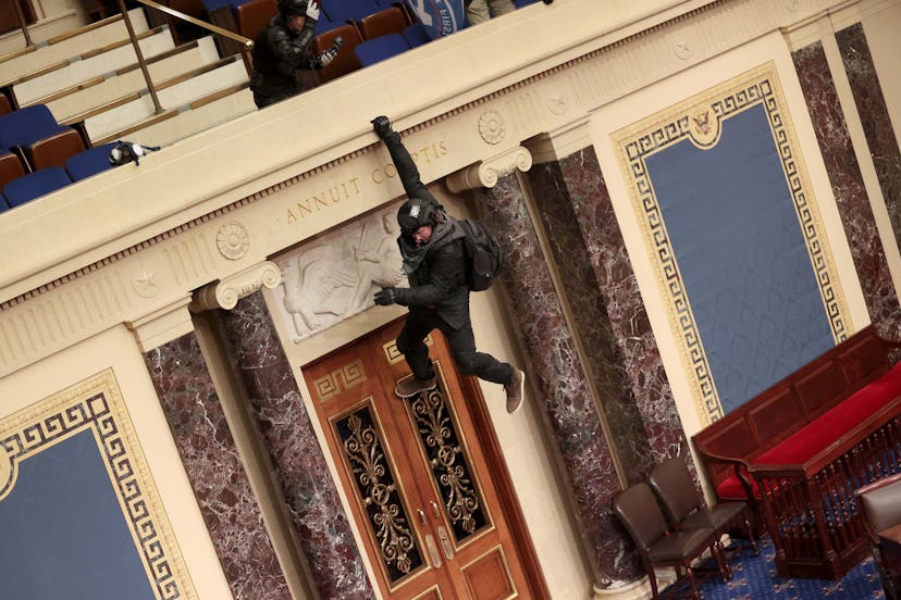 A terrorist scaling the walls of the Capitol