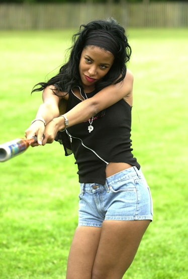 Aaliyah swinging a bat