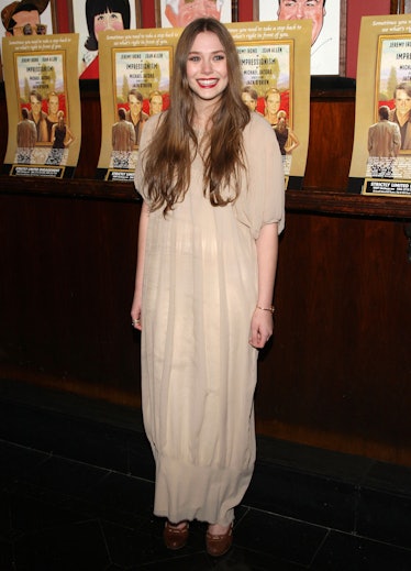 Young Elizabeth Olsen in a beige dress.
