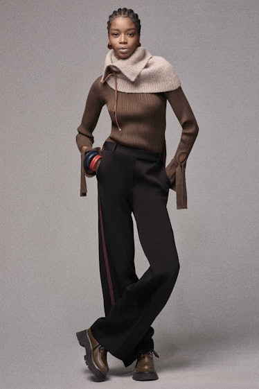 A model in a two-toned sweater and black pants by Phillip Lim