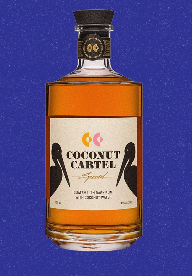 A bottle of Coconut Cartel Rum with two pelicans on the label 