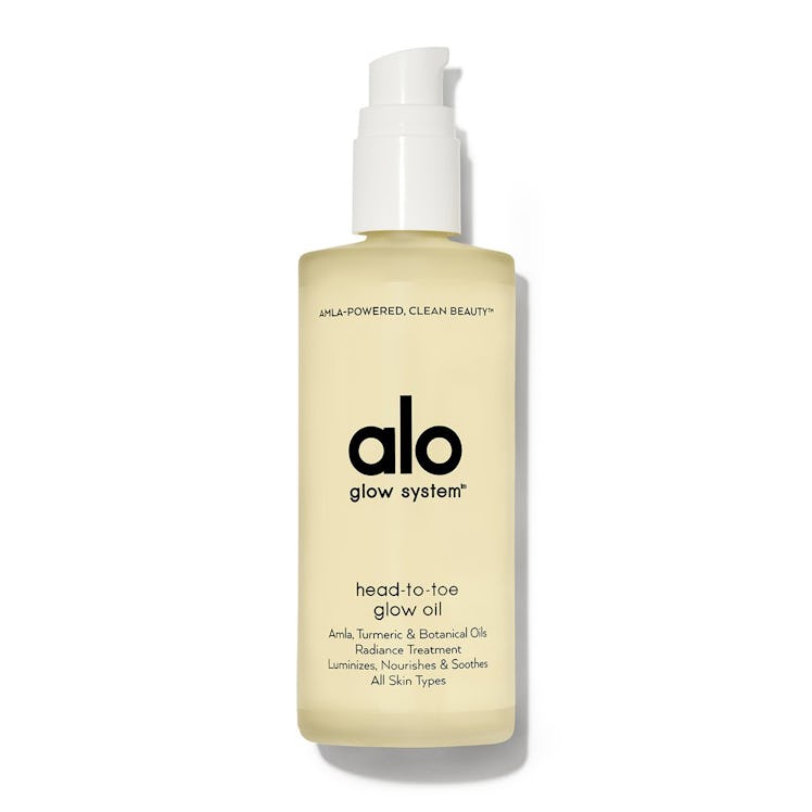 Alo Head-to-Toe Glow Oil in transparent packaging with a white pump on top 