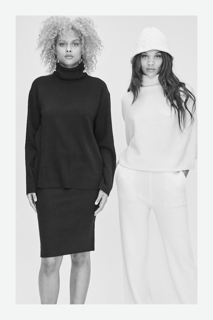 Two models on a polaroid wearing a black turtleneck and skirt, and a white turtleneck and pants by V...