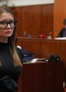 Anna Sorokin in glasses.