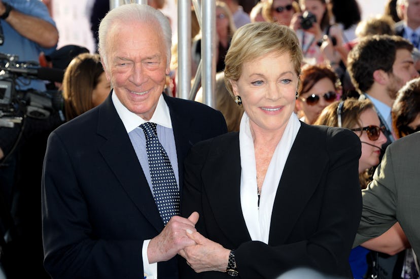 Julie Andrews holding hands with Christopher Plummer