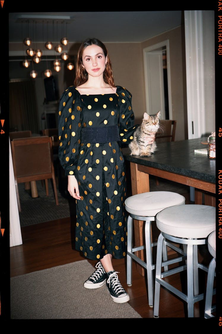 Maude Apatow in the fall 2021 Batsheva look book in a polka dot jumpsuit and black converse 