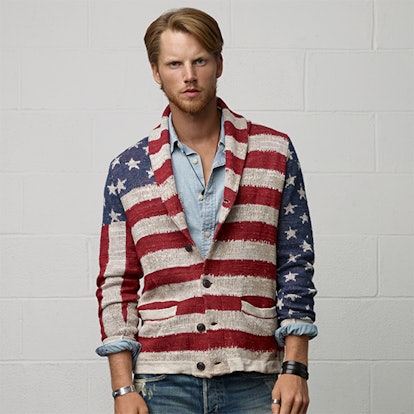 A male model posing in an American flag cotton cardigan from Denim & Supply