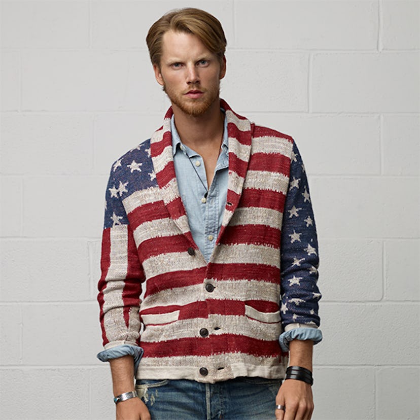 A male model posing in an American flag cotton cardigan from Denim & Supply