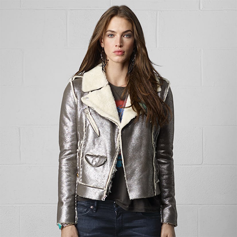 A young lady posing in a metallic moto jacket from Denim & Supply