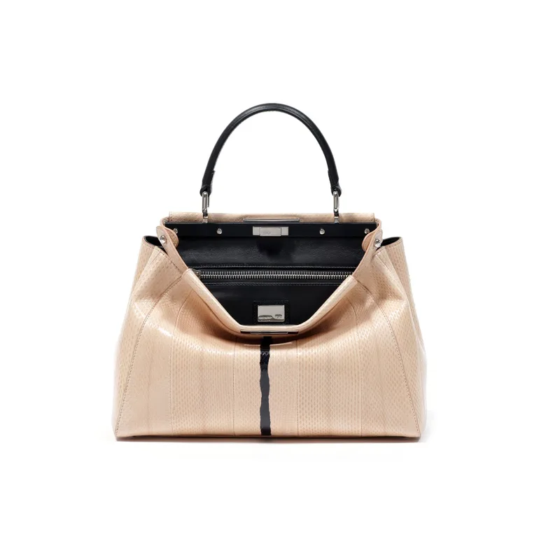 Play Peekaboo With This Luxe Pocketbook