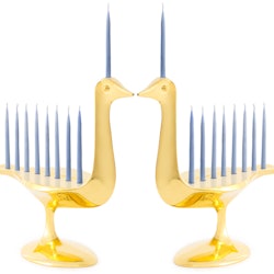 Two brass Menorahs shaped like two birds touching beaks 