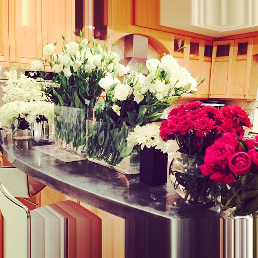 Flower arrangements placed on a kitchen table