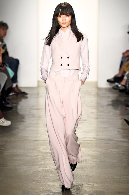 A model walking the runway in Marissa Webb's wide leg pants and a matching vest