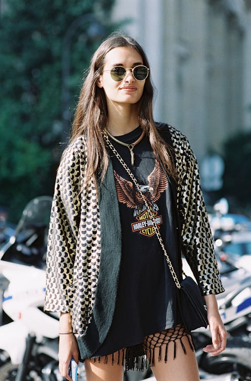 Young lady posing in thrift clothes