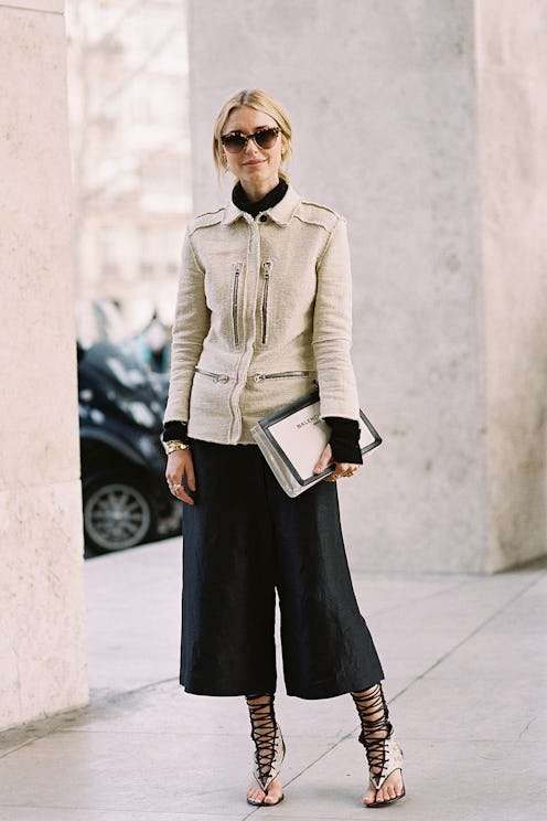 A model posing while wearing a spring street-style look