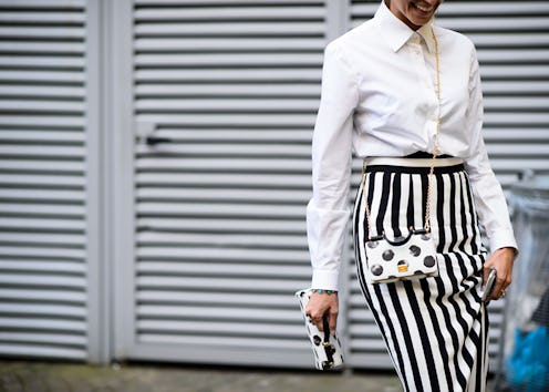 A woman wearing a dress with stripes