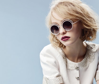 Lily-Rose Depp in a cream blazer, wearing pearl-adorned sunglasses for the Chanel Campaign