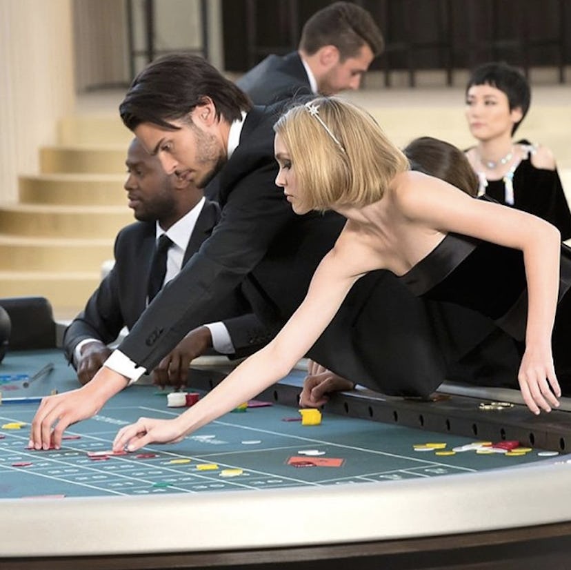 Lily-Rose Depp moving chips at Chanel's roulette tables