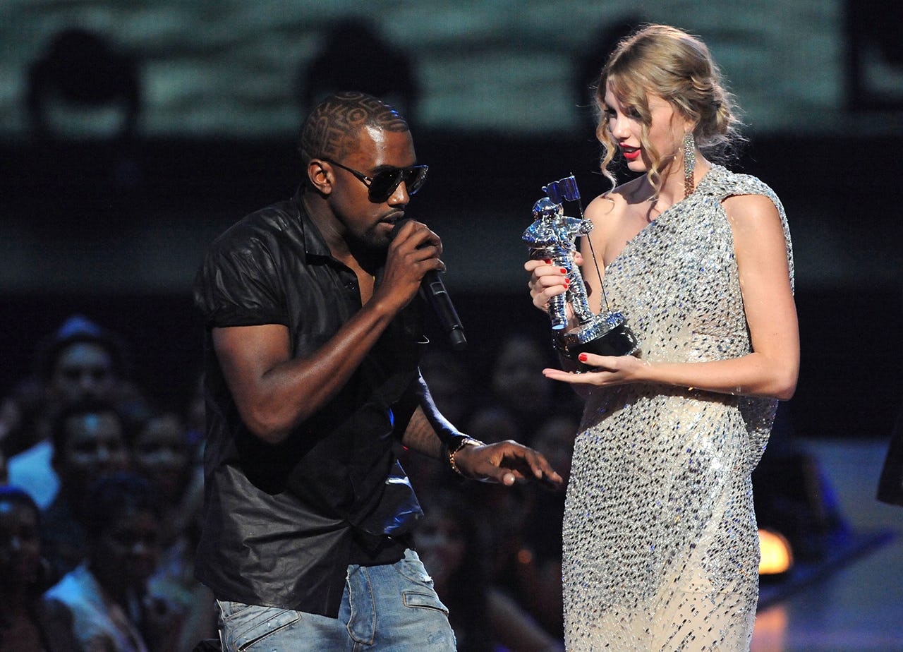 Kanye West interrupting the award acceptance speech of taylor swift at the VMAs