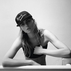 A portrait of transgender model Andreja Pejic in a black top