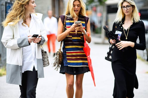 Three LGBT models talking on the street