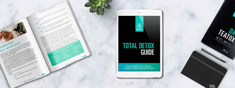 "Total Detox Guide" text sign on a tablet screen  