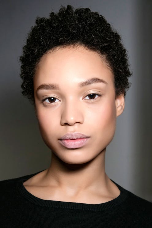 A close-up of a model's face who uses some of the best moisturizers for oily skin types