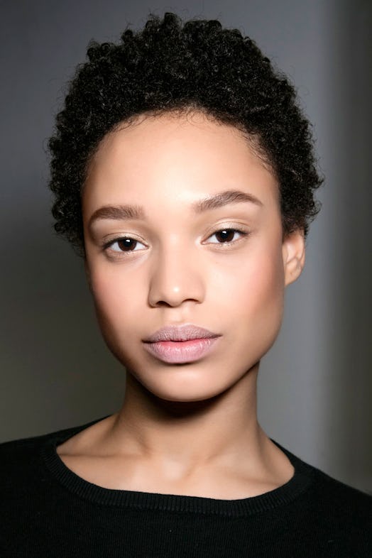 A close-up of a model's face with some of the best skin moisturizers 