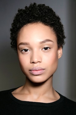 A close-up of a model's face who uses some of the best moisturizers for oily skin types
