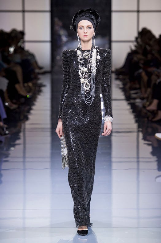 A model wearing Armani Privé sequined black gown from their Fall 2016 Couture Show