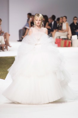 A model wearing a white puffed tulle Giambattista Valli gown from their Fall 2016 Couture Show