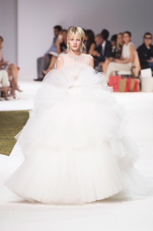A model wearing a white puffed tulle Giambattista Valli gown from their Fall 2016 Couture Show