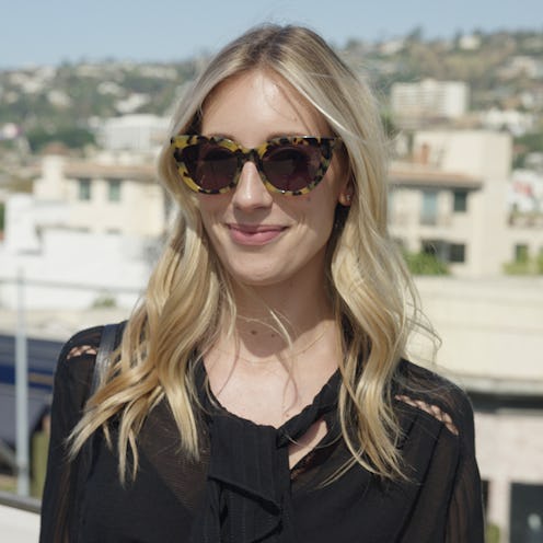 A blonde woman who is a fashion girl with a black top and leopard print sunglasses