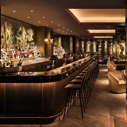 The bar section of  The Blond at 11 Howard St. in brown and neutral colors with cozy lighting