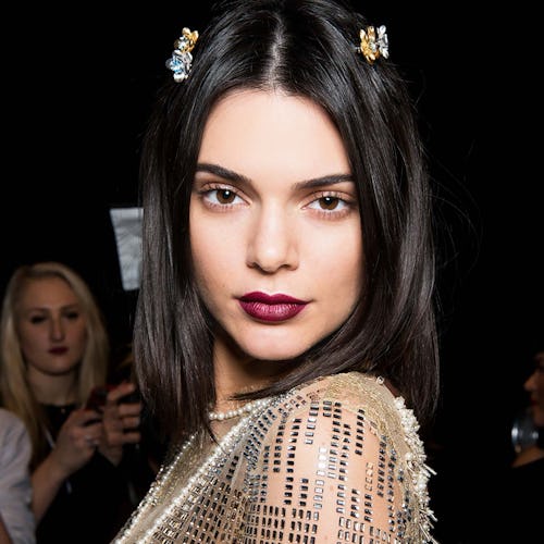 Kendall Jenner in this spring's must-have lip color mauve shade and a beige sequin dress
